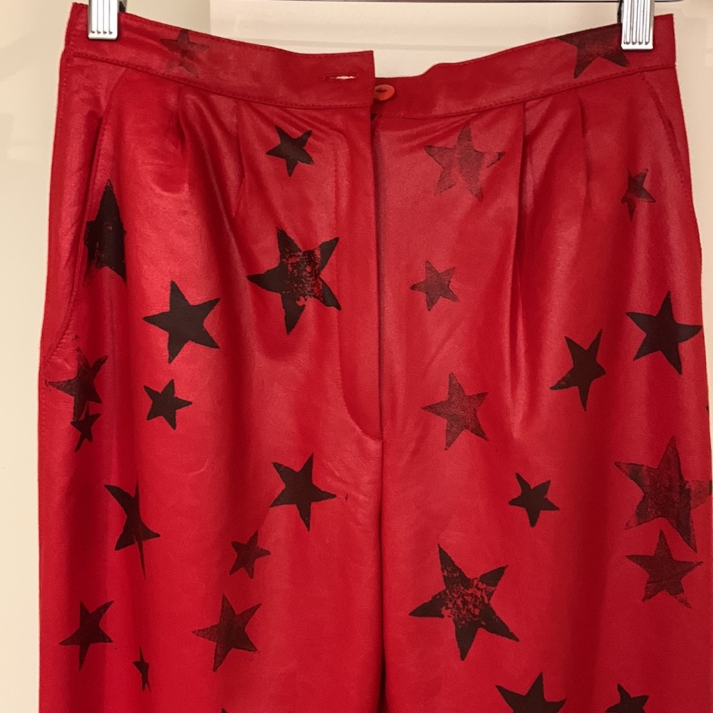 Red pants with black stars, fits like a size 6